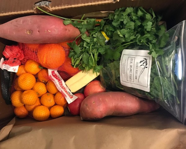 Box full of various fruits and vegetables