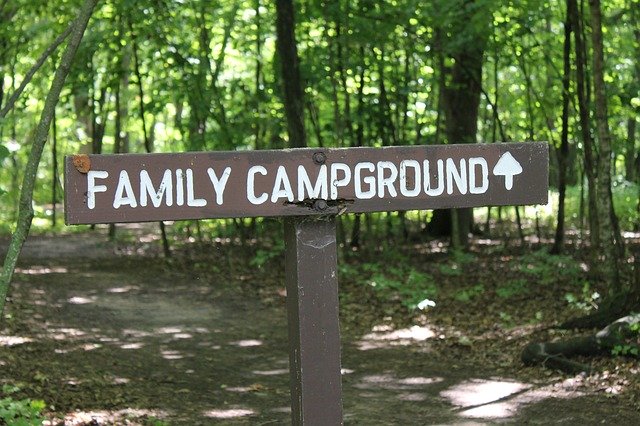 sign pointing to campground