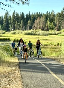 Family riding Tahoe Bike Company Bikes and E-Bikes