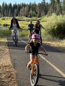 Parents and kid riding Tahoe Bike Company bikes
